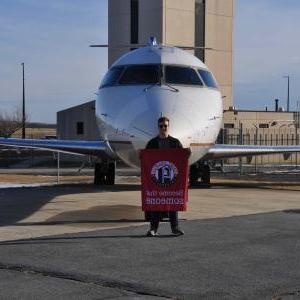 SFU Engineering-Aviation student in front of plane donated by Skywest